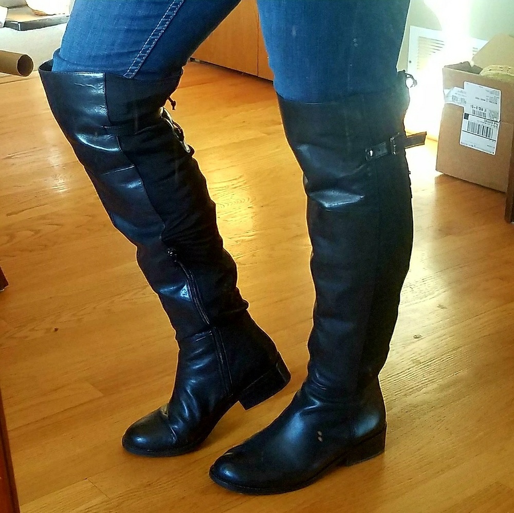 Black Over-the-Knee Leather Riding Boots.